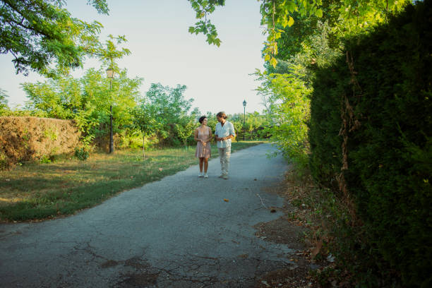 Couple walking along a road