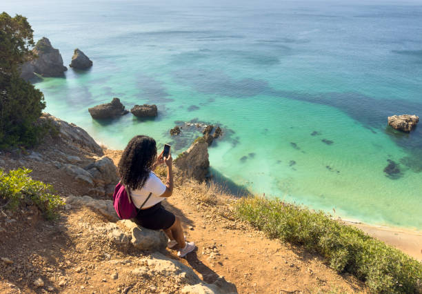 istock Tourist using smartphone in nature 2166054035