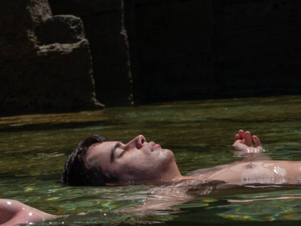 istock men floating and clam on the nice sea 2166054522