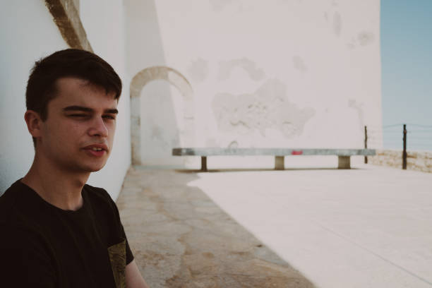 istock young men waiting on the cathedral 2166055158