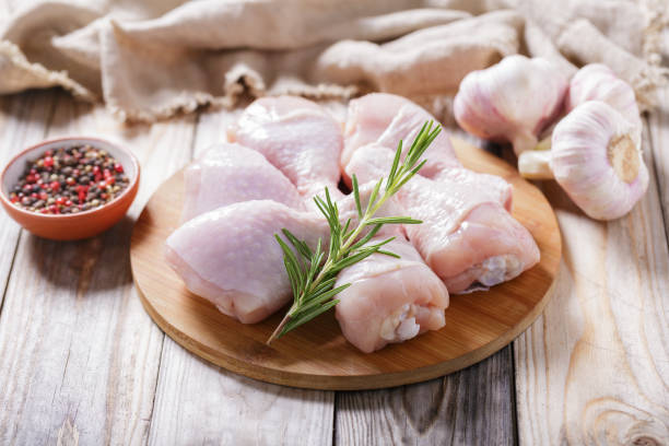 istock Fresh chicken legs with rosemary and vegetables 2166060499