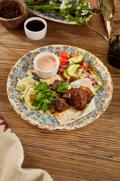 istock Grilled Shashlik with Vegetables and Onions on a Decorative Plate 2166061376