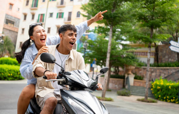 istock Loving couple riding on a motorcycle and having fun on vacations 2166065267