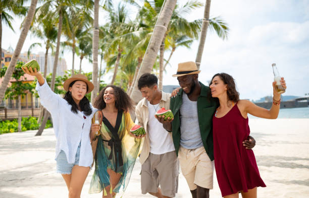istock Friends having fun at the beach and enjoying the summer 2166065290