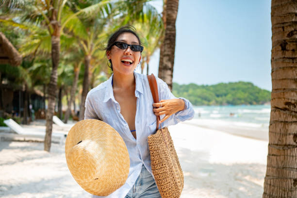 Asian woman having fun at the beach