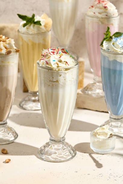 istock Colorful Milkshake Composition in Glasses with Whipped Cream and Toppings 2166065374