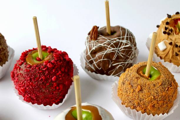 istock Assorted chocolate caramel candy apples colorful nuts 2166067046
