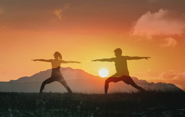 istock Couple exercising stretching at the sunset. 2166072564
