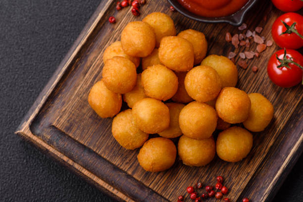 istock Cheese or potato balls breaded with salt, spices and herbs 2166072697