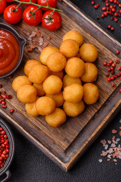 istock Cheese or potato balls breaded with salt, spices and herbs 2166072702