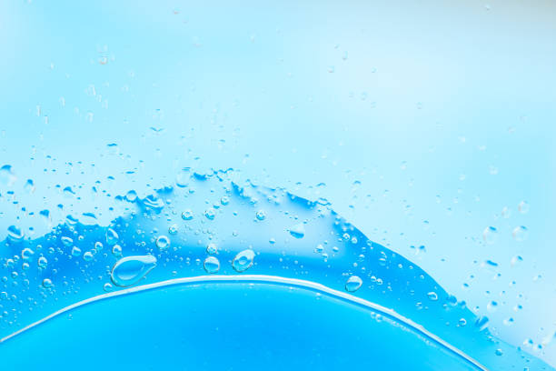 istock Close-up of blue liquid with bubbles and droplets, creating an abstract, refreshing, and clean appearance. 2166072815