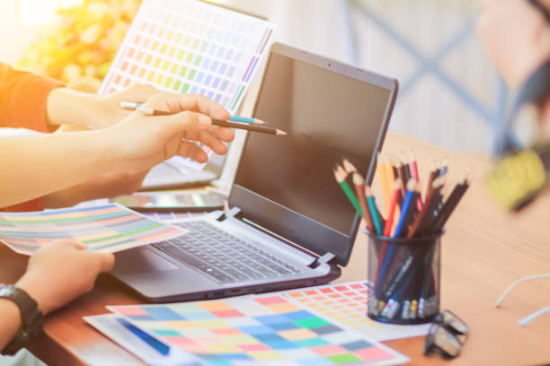 istock Smooth Focus, group of web designers are working together to develop mobile responsive website with UI UX Front End Designer Previewing. website designers in form of mobile applications with UI UX 2166074537