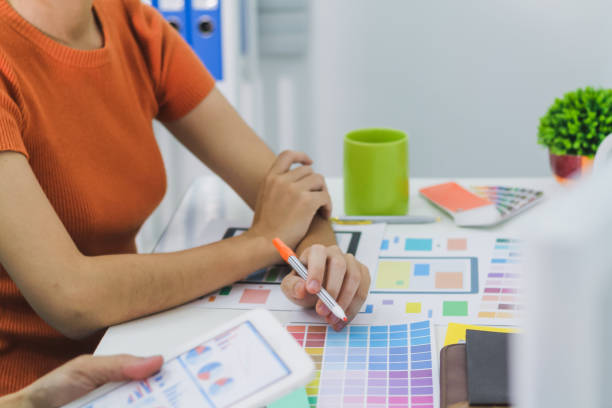 istock Smooth Focus, group of web designers are working together to develop mobile responsive website with UI UX Front End Designer Previewing. website designers in form of mobile applications with UI UX 2166074712