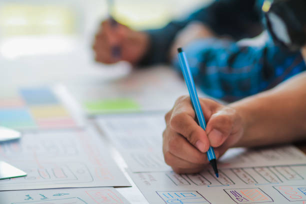 istock Smooth Focus, group of web designers are working together to develop mobile responsive website with UI UX Front End Designer Previewing. website designers in form of mobile applications with UI UX 2166074922