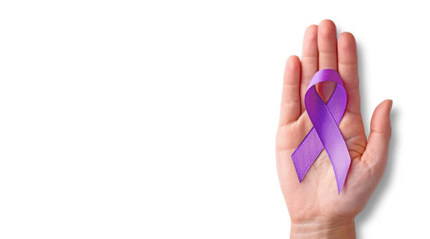 istock Hand holding purple awareness ribbon on white background 2166079362