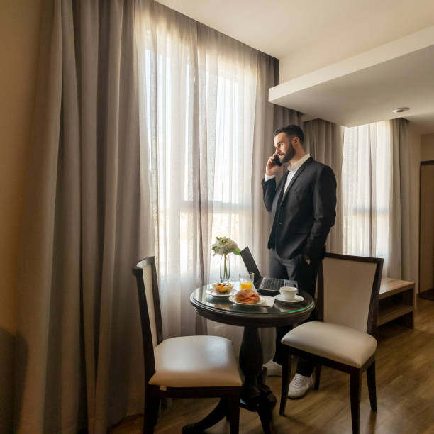 istock Businessman in a hotel room. 2166080013