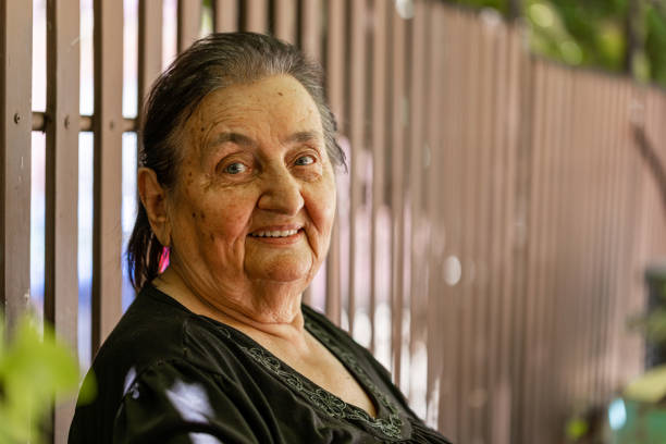 istock Senior woman is sitting in her yard 2166080047