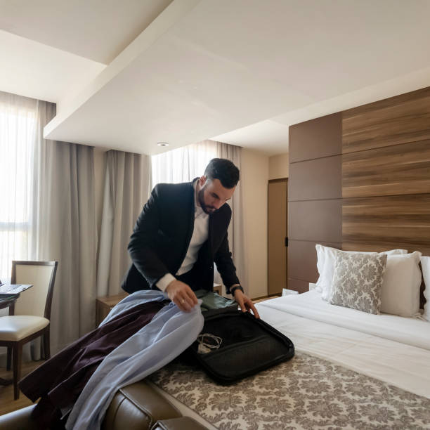 istock Businessman in a hotel room. 2166080132