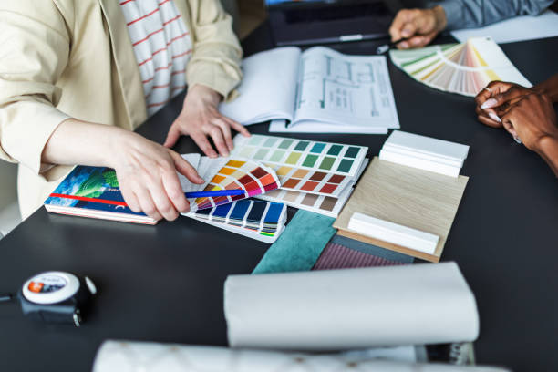 istock Interior designer meeting with clients and discussing new flat project 2166083692