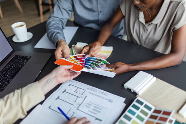 istock Interior designer meeting with clients and discussing new flat project 2166083739