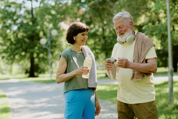 istock Senior Couple Taking Break during Running 2166083903