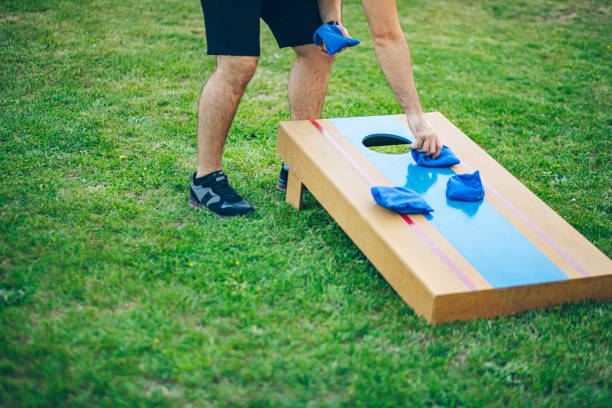 istock Playing bean bag toss in the backyard 2166086124
