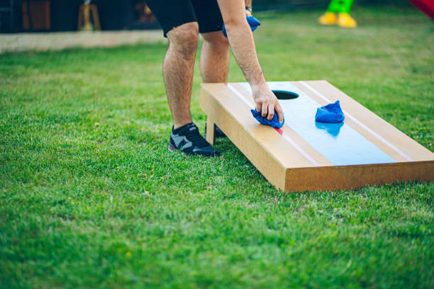 istock Playing bean bag toss in the backyard 2166086183