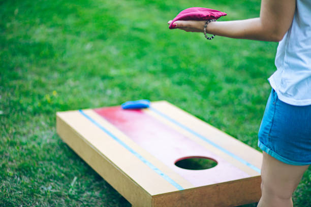 istock Playing bean bag toss in the backyard 2166086197