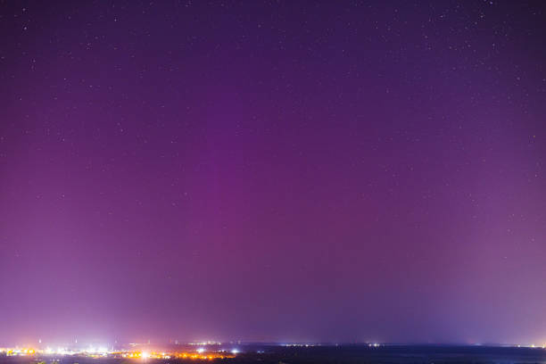 Night sky. Northern lights. Cityscape