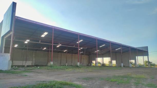 istock The unfinished warehouse building with one side have not built wall yet 2166094675