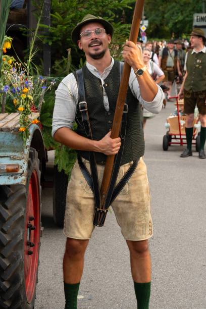 Gauboden folk festival, Straubing, Lower Bavaria, Germany, August 9 2024, procession to the festival site, flag bearer