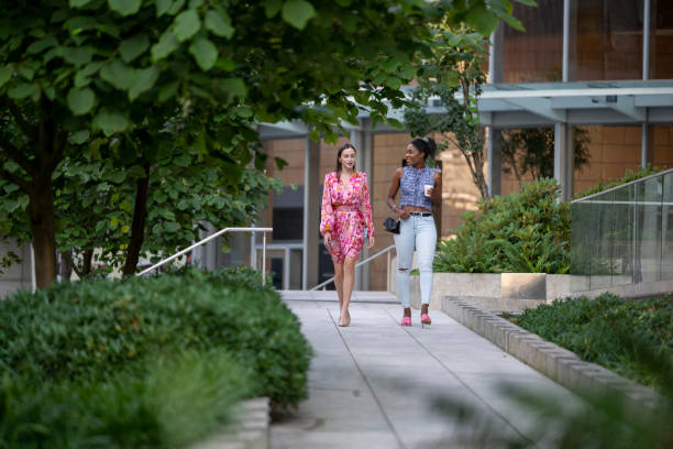 Young women walk on paved pathway, Vancouver