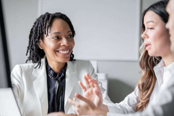 istock Diverse group of corporate office workers investigate problem and collaborate on solutions in modern office 2166099865
