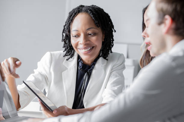 istock Diverse group of corporate office workers investigate problem and collaborate on solutions in modern office 2166099937