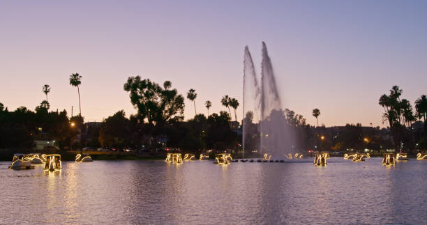 A wide shot of Echo Park Lake on a warm Summer sunset in Los Angeles, California.