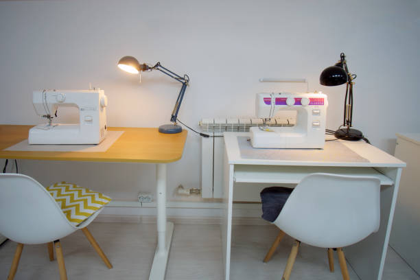 istock Interior of a tailor's studio, sewing machine and white chair 2166103000
