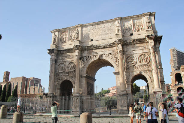 Rome, Italy - September 14 2022: Triumphal or Constantine Arch in Rome, Italy with Tourists