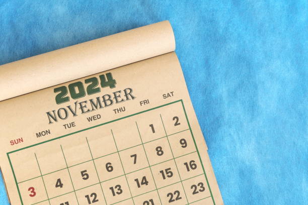 istock November 2024 calendar flat lay in blue background with copy space. 2166112122