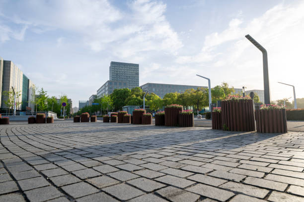An empty square in front of modern urban architecture