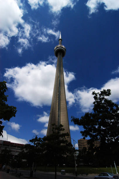 The CN Tower is a 553.3 m-high concrete communications and observation tower in Toronto, Ontario, Canada. Completed in 1976, it is located in downtown Toronto, built on the former Railway Lands. Its name \