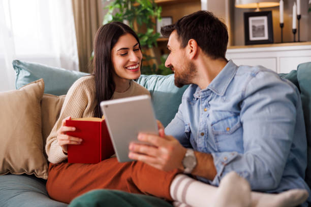 istock Couple reading at home 2166118339