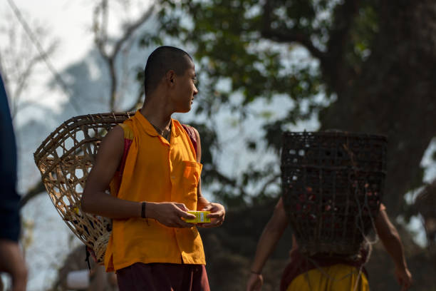 3rd March, 2024, Buxa Zoro point, Alipur Duar, West Bengal, India: A Buddist Monks or Lama Going to Monastery for prey.