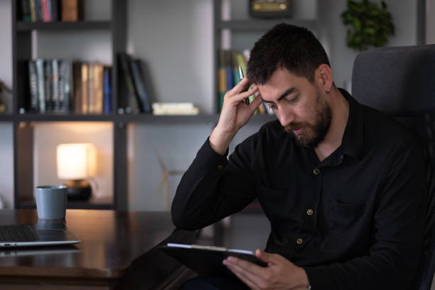 istock businessman working at home with digital tablet 2166125705