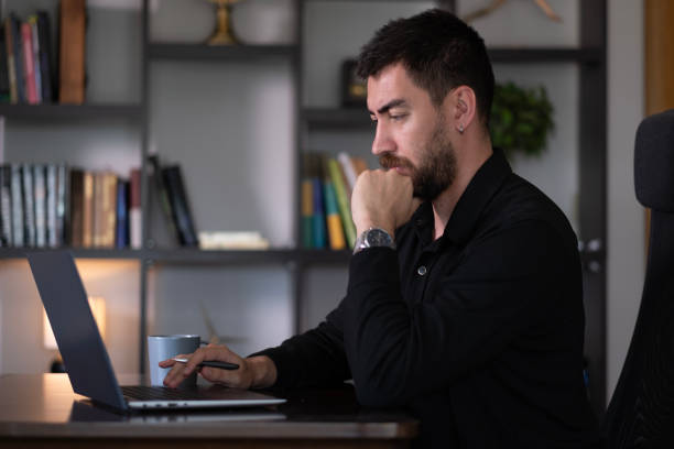 istock businessman working at home with laptop 2166125729