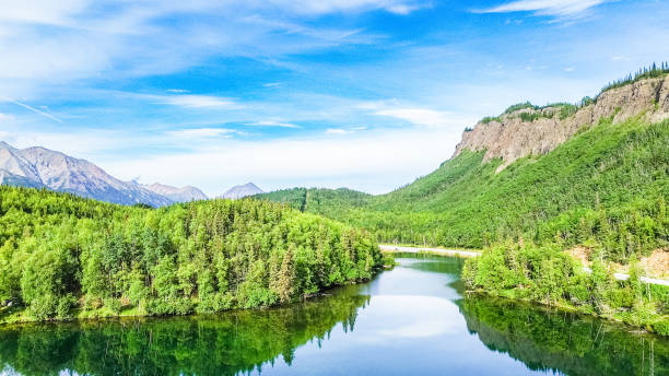 Drone picture over the calm waters of Long Lake, located in Alaska. This beautiful lake sits amongst the Chugach Mountains.