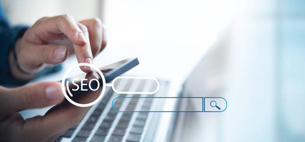 istock SEO, Search Engine Optimization, digital marketing concept. Businessman using laptop computer and mobile phone for analysis with SEO online marketing ranking traffic website, internet business technology 2166127161