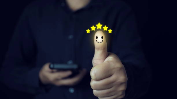 Hand with thumb up Positive emotion smiley face icon and five star with copy space.Customer satisfaction concept.