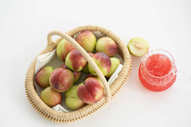 Fresh Organic Heavenly Peaches on white background.