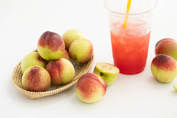 Fresh Organic Heavenly Peaches on white background.