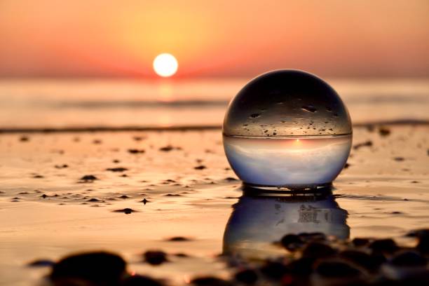 istock Crystal ball on the shore during dawn 2166128917